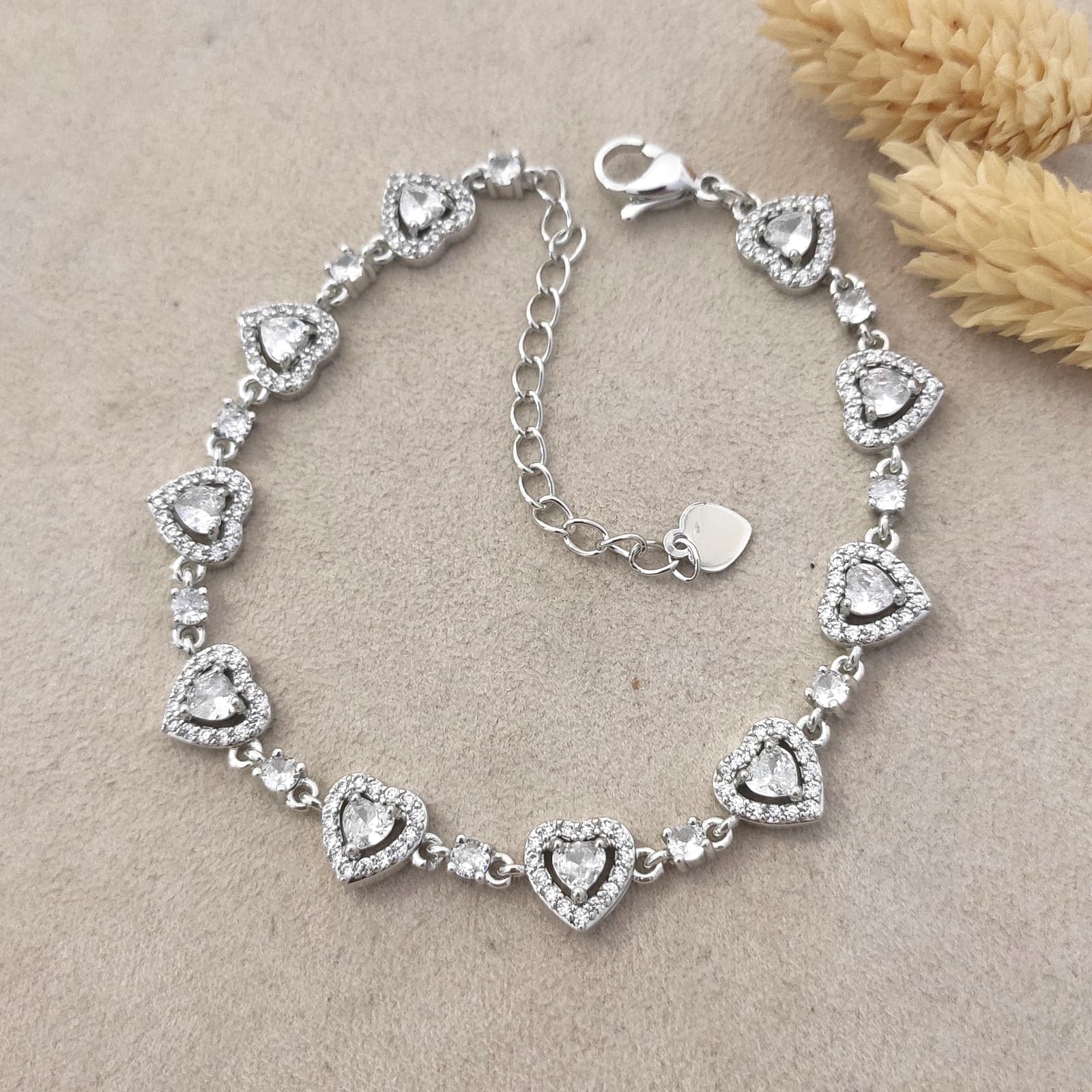 Rhodium Plated Zircon Stone Full Heart Sequence Bracelet on Brass