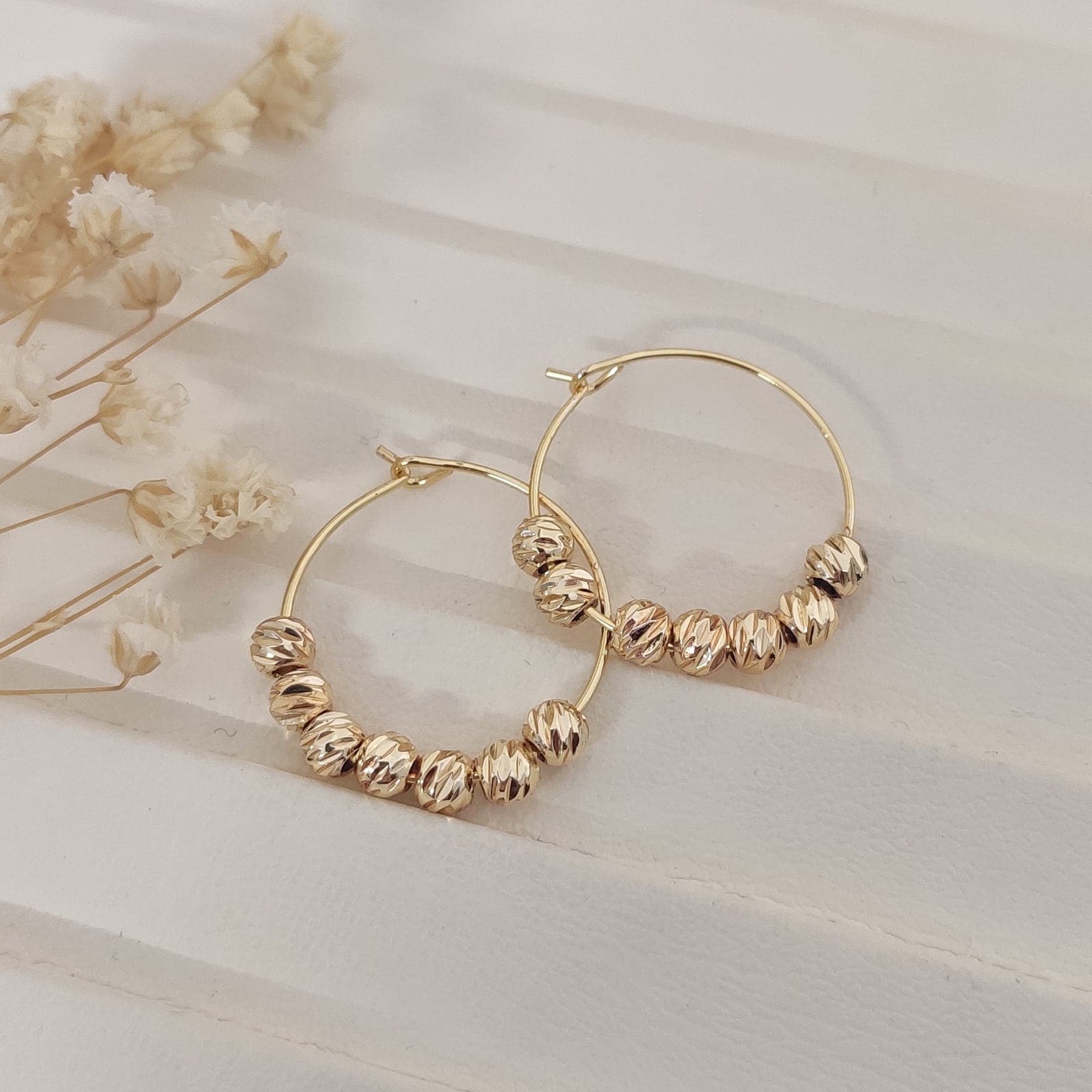 Gold Plated Dorica Ball Stringed Tiny Hoop Earrings on Brass