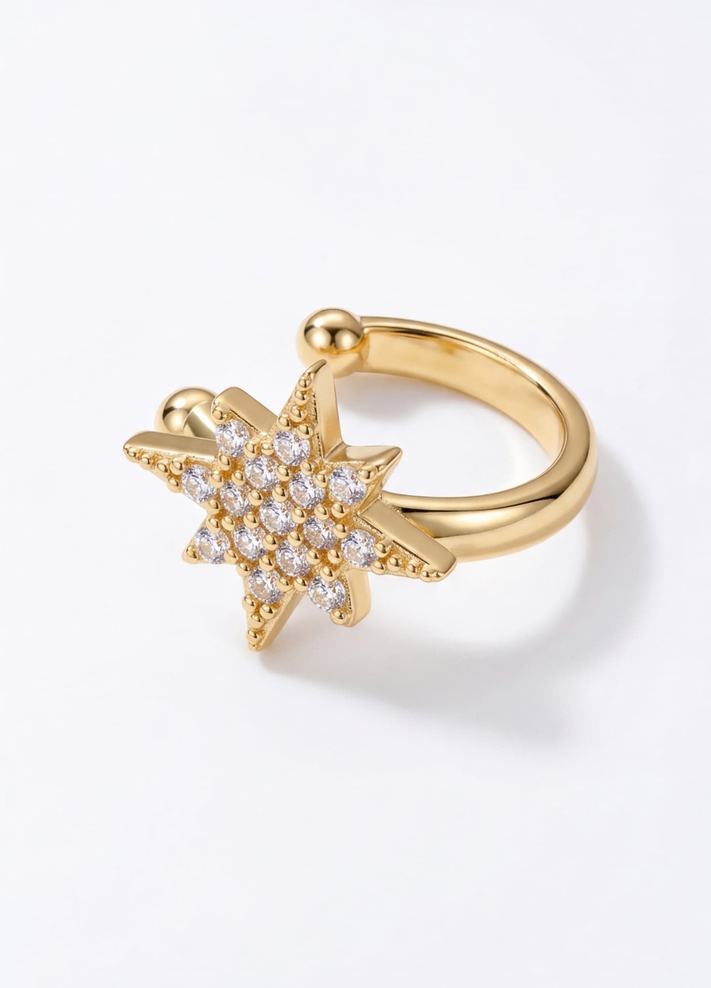 Polar star cartilage earrings with gold-tone zircon stones on brass